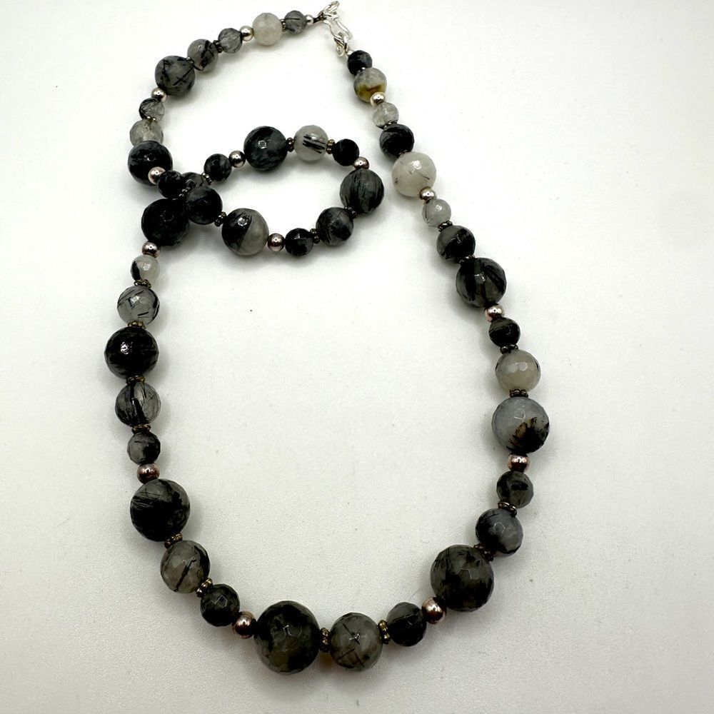 19" of all faceted, rutilated quartz beaded necklace with silver‎ tone hardware!
